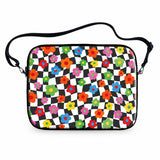 Floral Check laptop sleeve with colorful daisies on warped black and white checkerboard with carrying strap